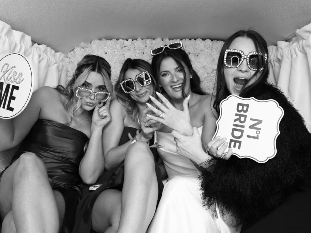 Guests posing inside Penny the Photo Bus at a Florida wedding